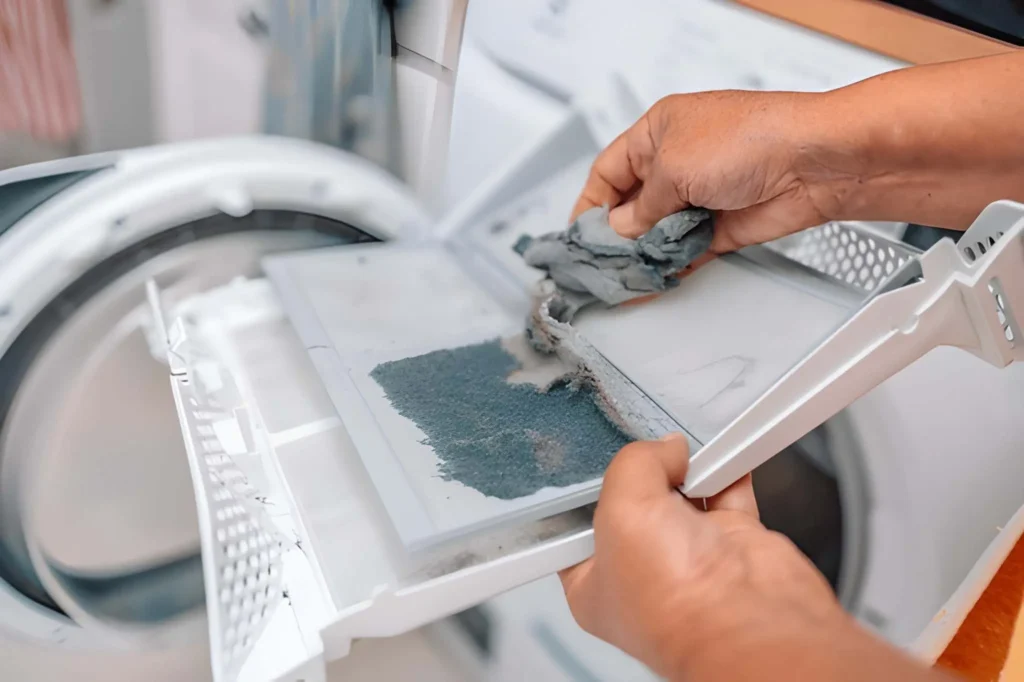 Close-up of technician performing Dryer Vent Cleaning to improve airflow and reduce fire risk.